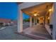 Covered back patio with ceiling fans and view of the landscaped backyard at 2740 Billy Casper Dr, Las Vegas, NV 89134