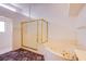 Relaxing bathroom boasts a soaking tub, separate shower, and neutral tile, creating a spa-like experience at 2740 Billy Casper Dr, Las Vegas, NV 89134