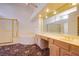 Bright main bathroom features double sinks, large mirrors, and separate shower and tub at 2740 Billy Casper Dr, Las Vegas, NV 89134