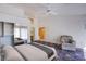 Spacious bedroom featuring neutral walls, an accent rug, chair, and ample closet space at 2740 Billy Casper Dr, Las Vegas, NV 89134