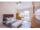 Well-lit bedroom showcasing tile floors, a queen bed, and a large window at 2740 Billy Casper Dr, Las Vegas, NV 89134
