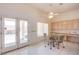 Sunny breakfast nook featuring tile flooring, built-in cabinets, and access to the patio through French doors at 2740 Billy Casper Dr, Las Vegas, NV 89134