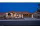 Charming single-story home featuring desert landscaping, a terra cotta roof, and an attached two-car garage at 2740 Billy Casper Dr, Las Vegas, NV 89134