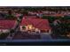 Inviting single-story home featuring a terra cotta roof, manicured landscaping, and an attached two-car garage at 2740 Billy Casper Dr, Las Vegas, NV 89134
