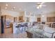 Open concept kitchen with breakfast nook flows into a cozy living area with fireplace and built-in shelving at 2740 Billy Casper Dr, Las Vegas, NV 89134