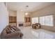 Cozy living room with built-in shelving, fireplace, and large windows providing ample natural light at 2740 Billy Casper Dr, Las Vegas, NV 89134