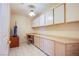 Bright office space with built-in desk and lots of storage cabinetry at 2740 Billy Casper Dr, Las Vegas, NV 89134