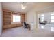 Bright office space with custom built-in shelving and adjacent view of living area, perfect for working from home at 2740 Billy Casper Dr, Las Vegas, NV 89134