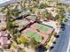 Well-maintained tennis courts surrounded by mature landscaping, adjacent to the parking lot and building at 2740 Billy Casper Dr, Las Vegas, NV 89134