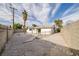 Backyard has gravel landscaping, a covered patio, and concrete perimeter at 2905 Dogwood Ct, North Las Vegas, NV 89030