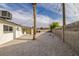 Backyard has gravel landscaping, concrete perimeter and a large palm tree at 2905 Dogwood Ct, North Las Vegas, NV 89030