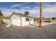 Backyard has a storage shed, gravel landscaping, and a covered patio at 2905 Dogwood Ct, North Las Vegas, NV 89030