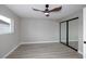Modern bedroom featuring light wood-look floors and a ceiling fan at 2905 Dogwood Ct, North Las Vegas, NV 89030