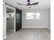 Bedroom featuring wood-look flooring and a modern ceiling fan at 2905 Dogwood Ct, North Las Vegas, NV 89030