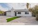 Cozy single-story home with a modern exterior and a well-maintained front yard at 2905 Dogwood Ct, North Las Vegas, NV 89030