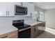 Updated kitchen featuring stainless appliances, stone countertops, and ample cabinet space at 2905 Dogwood Ct, North Las Vegas, NV 89030