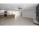 Bright, open living area with modern kitchen, gray walls and floors, and stainless appliances at 2905 Dogwood Ct, North Las Vegas, NV 89030