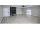 Bright living room featuring gray walls, wood floors, and a sliding glass door to a patio at 2905 Dogwood Ct, North Las Vegas, NV 89030