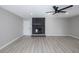 Bright living room featuring gray walls, wood floors, and a modern fireplace at 2905 Dogwood Ct, North Las Vegas, NV 89030