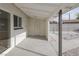Bright, covered patio with whitewashed ceiling, door and access to the backyard at 2905 Dogwood Ct, North Las Vegas, NV 89030