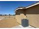 Side view of home with neutral stucco and air conditioning unit at 3016 Mount Charleston Dr, Pahrump, NV 89048