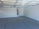 View of spacious garage with water heater and door to interior at 3016 Mount Charleston Dr, Pahrump, NV 89048