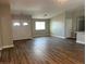 Spacious living room showcasing wood-look floors and a bright entry with arched double-doors at 3016 Mount Charleston Dr, Pahrump, NV 89048