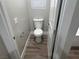 Powder room with wood-look flooring and modern fixtures at 3016 Mount Charleston Dr, Pahrump, NV 89048