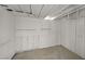 Unfinished basement featuring bare wood framing, concrete floor, and basic shelving at 3124 Glenhurst Dr, Las Vegas, NV 89121