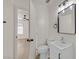Bathroom featuring a modern white vanity and a shower/tub combo with white tiling at 3124 Glenhurst Dr, Las Vegas, NV 89121