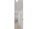 Bright hallway with neutral paint and neutral colored tile flooring at 3124 Glenhurst Dr, Las Vegas, NV 89121