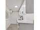 Modern kitchen featuring sleek white cabinets, marble countertops, and a stylish black faucet at 3124 Glenhurst Dr, Las Vegas, NV 89121