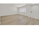 Spacious living room with light flooring and a window providing natural light at 3124 Glenhurst Dr, Las Vegas, NV 89121