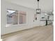 Open living area with great natural light and access to the kitchen at 3124 Glenhurst Dr, Las Vegas, NV 89121
