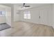 Light-filled living room with neutral flooring, a ceiling fan, and a large window at 3124 Glenhurst Dr, Las Vegas, NV 89121