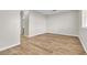 Empty room with laminate flooring at 3676 Renovah St # 102, Las Vegas, NV 89129