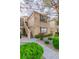 Condominium exterior features a well-maintained facade, landscaping, and visible unit numbers at 3676 Renovah St # 102, Las Vegas, NV 89129