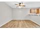 Inviting living room features a ceiling fan, open space, and modern wood flooring at 3676 Renovah St # 102, Las Vegas, NV 89129