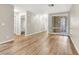 Open-concept living room with light wood flooring and natural light from the window at 3676 Renovah St # 102, Las Vegas, NV 89129