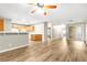 Open living and kitchen area featuring modern flooring and natural light from the window at 3676 Renovah St # 102, Las Vegas, NV 89129