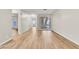 Bright living room featuring modern flooring and large window at 3676 Renovah St # 102, Las Vegas, NV 89129