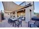 Charming backyard patio area with shade cover, perfect for outdoor entertaining and dining at 3846 W Neal Ave, Las Vegas, NV 89141