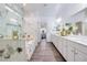 Elegant bathroom featuring marble accents, a glass-enclosed shower, and a vanity at 3846 W Neal Ave, Las Vegas, NV 89141