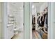 Bright bathroom featuring a tub-shower combo and a connected walk-in closet at 3846 W Neal Ave, Las Vegas, NV 89141