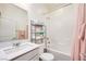 Well-lit bathroom with shower-tub combo and modern fixtures at 3846 W Neal Ave, Las Vegas, NV 89141