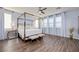 Bright bedroom with four-poster bed, ceiling fan and ample natural light at 3846 W Neal Ave, Las Vegas, NV 89141