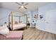 Bedroom featuring a bed, desk, shelves, and a ceiling fan at 3846 W Neal Ave, Las Vegas, NV 89141