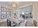 Bright dining area featuring stylish chandelier and artwork, open to the living space at 3846 W Neal Ave, Las Vegas, NV 89141