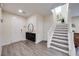 Inviting entryway with staircase, modern storage, and wood-look flooring at 3846 W Neal Ave, Las Vegas, NV 89141