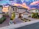 Charming home with brick driveway, two-car garage, and landscaped front yard at 3846 W Neal Ave, Las Vegas, NV 89141